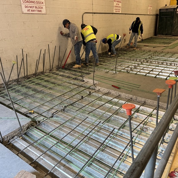 Parking garage repair in NYC with traffic-bearing membrane installation by Malatesta Paladino, preventing water infiltration and structural deterioration.